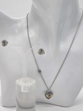 Juicy Couture matching jewelry set featuring a silver-tone necklace with a dimen